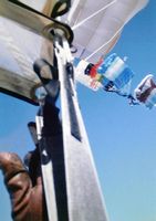 3 Parachutes linked together with the cameraman about to dock